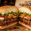 Burger King Whopper burger with lettuce, tomato, and sesame bun