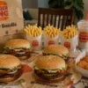 Burger King family deals bundle with Whoppers, fries, and chicken nuggets on a table